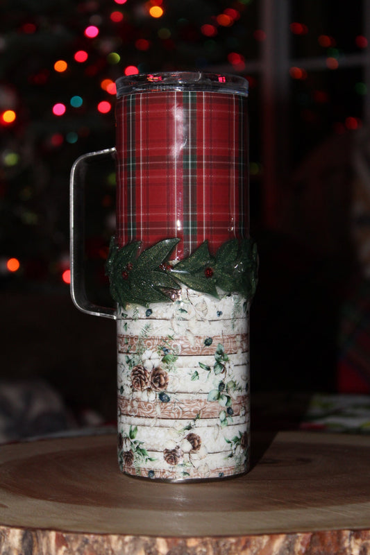 Christmas tumbler with holly accent.  20 oz. stainless steel tumbler with lid and reusable straw.